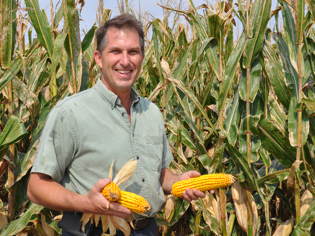 Matt Hughes is considering switching from more costly biotech seed to conventional corn and soybeans in 2015 to cut his input costs. (DTN photo by Emily Unglesbee)